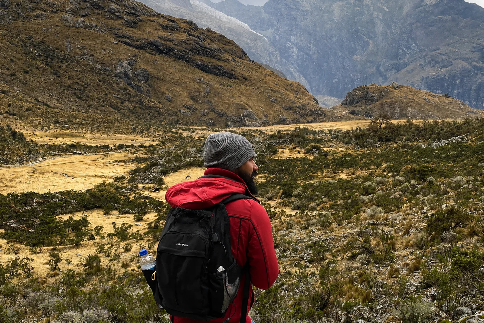 David standing on a rocky mountain trail.